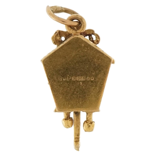 3612 - 9ct gold and enamel cuckoo clock charm, 2.1cm high, 2.5g