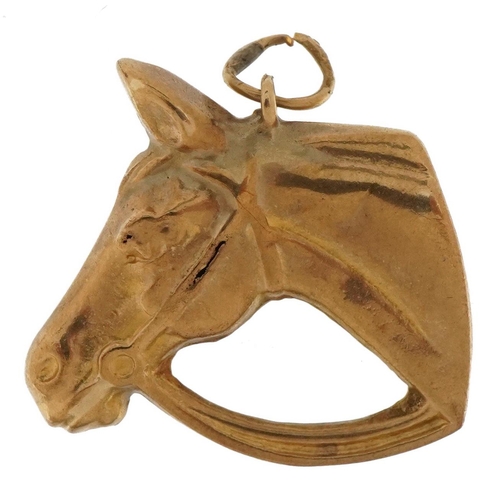 3692 - 9ct gold horsehead charm, 2.3cm high, 1.5g