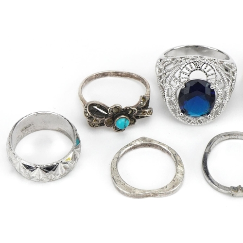 3703 - Nine silver and white metal rings including one set with a solitaire blue stone, cabochon turquiose ... 