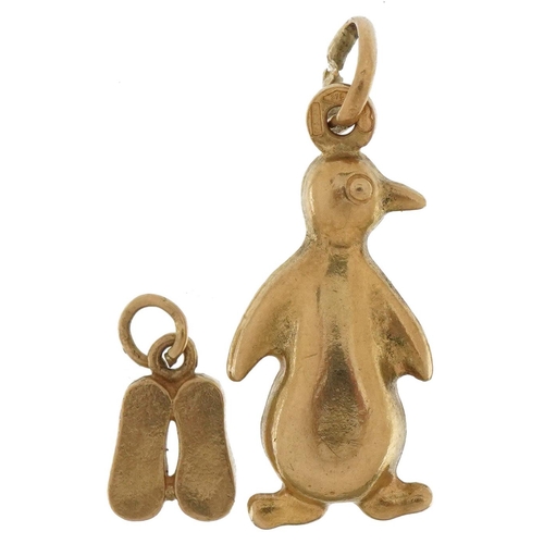 3700 - Two 9ct gold charms comprising penguin and pair of slippers, the largest 2.4cm high, total 1.8g