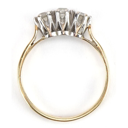 3011 - Unmarked gold diamond three stone ring, tests as 18ct gold, total diamond weight approximately 0.25 ... 