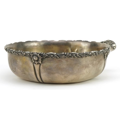 692 - Tiffany & Co, sterling silver one pint porringer cast with stylised flowers and foliage, numbered 14... 