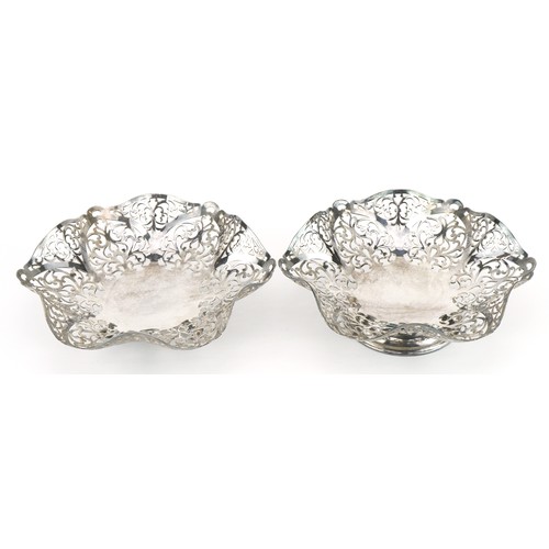 688 - Two Elizabeth II circular silver bonbon dishes, each pierced with foliage, FRS maker's mark London 1... 