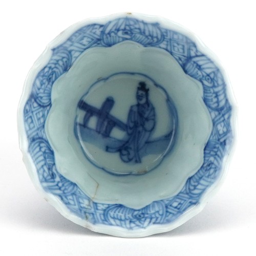 590 - Chinese blue and white porcelain fluted tea bowl hand painted with panels of figures, 6.5cm in diame... 