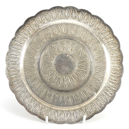 103 - Persian white metal circular tray with engraved decoration, impressed marks to the base, 21.5cm in d... 