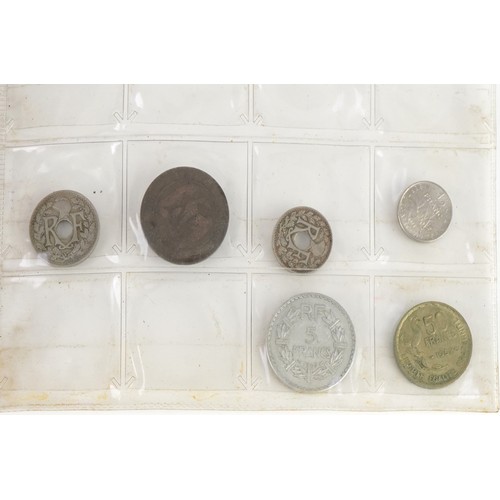 1597 - Antique and later world coinage arranged in an album including 1951 Canadian five cents