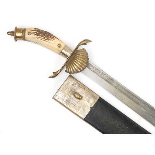 1410 - Military interest short sword and scabbard with staghorn handle and engraved steel blade, 82cm in le... 