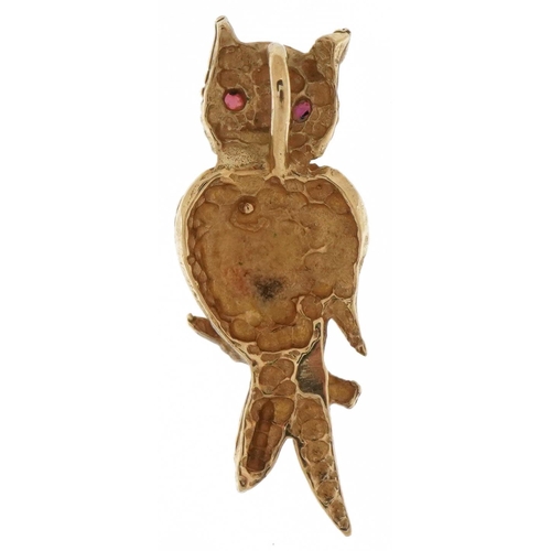 3502 - 9ct gold owl pendant with ruby eyes, 2.2cm high, 1.0g