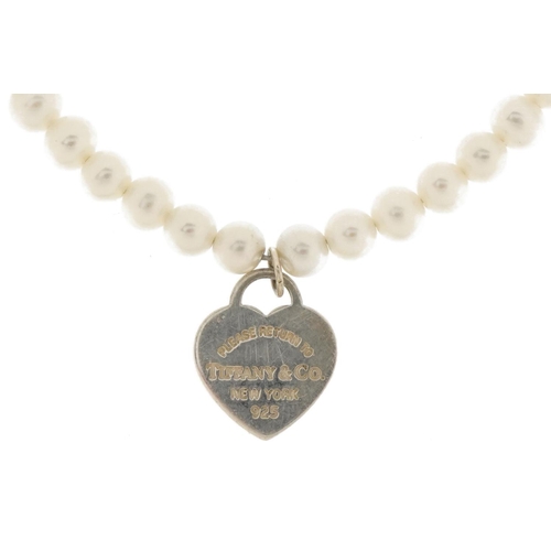 3659 - Tiffany & Co, cultured pearl and silver bracelet with love heart charm, 16cm in length, 4.6g