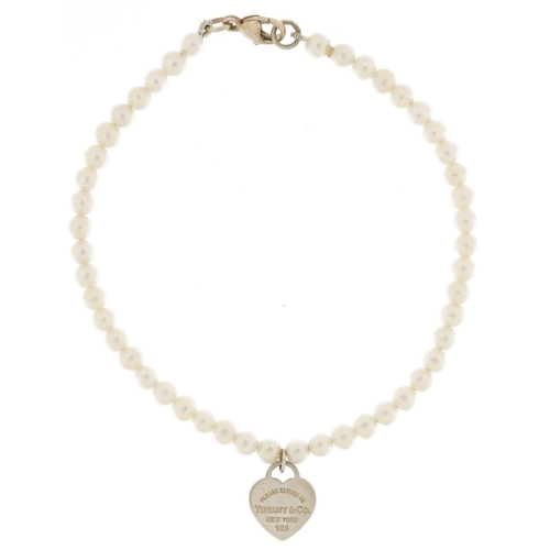 3659 - Tiffany & Co, cultured pearl and silver bracelet with love heart charm, 16cm in length, 4.6g