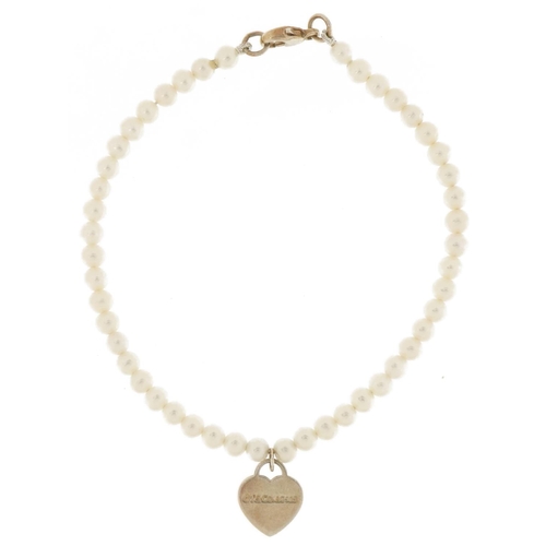 3659 - Tiffany & Co, cultured pearl and silver bracelet with love heart charm, 16cm in length, 4.6g