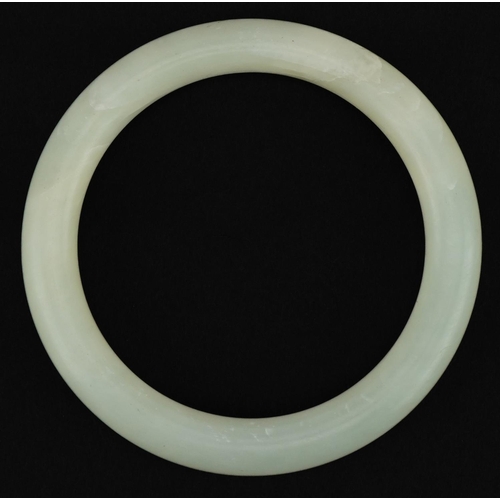 3582 - Chinese white jade bangle, 7.5cm in diameter, 41.5g