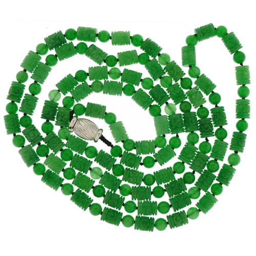 3150 - Chinese carved green jade necklace with 18ct white gold clasp, the cylindrical beads each approximat... 