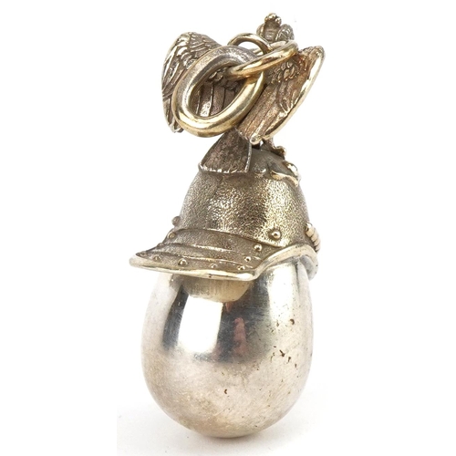 3630 - Silver gilt Russian helmet egg pendant, impressed Russian marks to the suspension loop, 4.5cm high, ... 