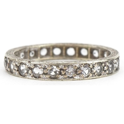 3395 - White gold clear stone eternity ring, indistinct hallmarks, size J/K, 2.0g