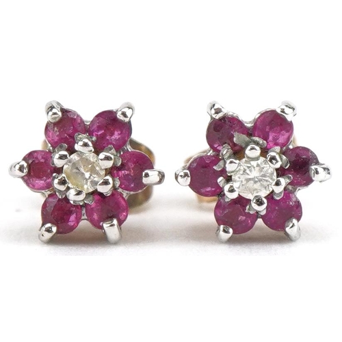 3549 - Pair of 9ct gold ruby and diamond flower head stud earrings, 6mm in diameter, 0.8g