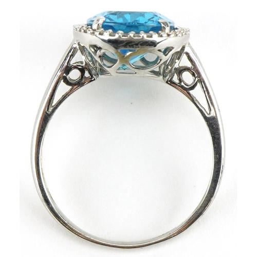 3088 - Large 9ct white gold blue topaz and diamond ring with pierced shoulders, the topaz approximately 14.... 