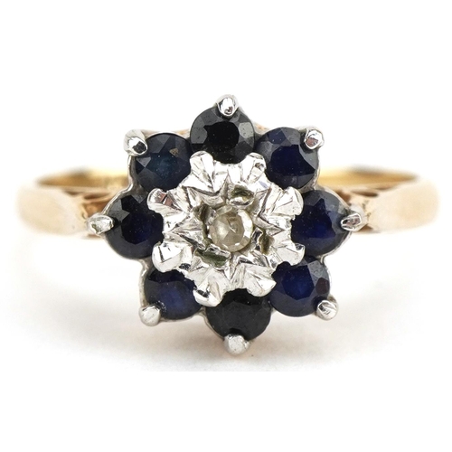 3357 - 9ct gold diamond and blue spinel flower head ring, size K, 1.9g