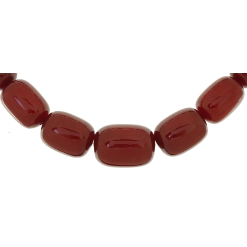 3058 - Large cherry amber bead necklace, the largest bead approximately 27mm x 18mm in diameter, overall 70... 