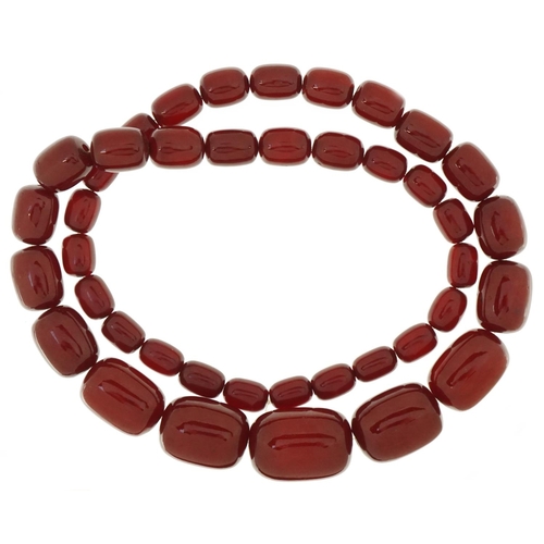 3058 - Large cherry amber bead necklace, the largest bead approximately 27mm x 18mm in diameter, overall 70... 