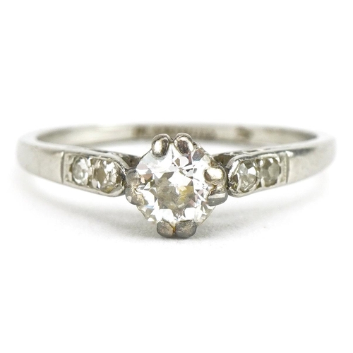 3066 - Platinum diamond solitaire ring with diamond set shoulders, the central diamond approximately 0.35 c... 