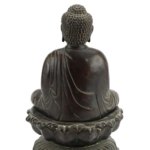 69 - Large Chinese patinated bronze figure of Shakyamuni Buddha on lotus stand, 37cm high