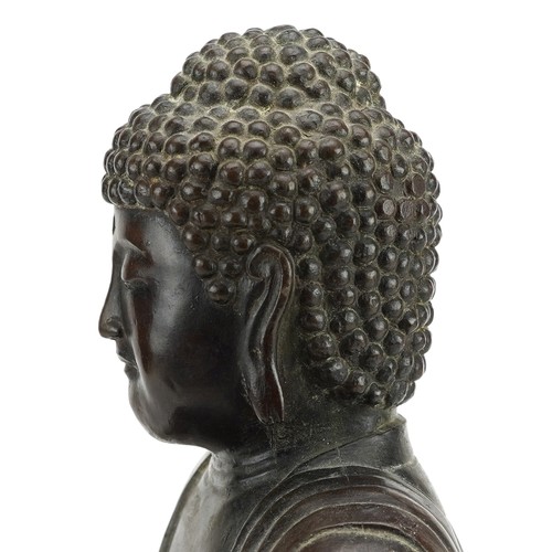 69 - Large Chinese patinated bronze figure of Shakyamuni Buddha on lotus stand, 37cm high