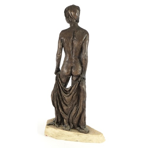 571 - Manner of Neil Godfrey, Mid century style bronzed sculpture of a nude standing female on naturalisti... 