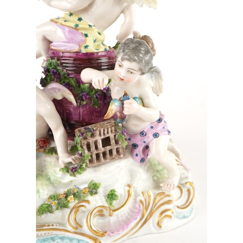 243 - Manner of Meissen, 19th century porcelain 'Vintner' centrepiece modelled in the form of three Putti ... 