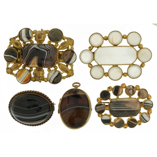 3060 - Four antique and later Scottish agate and white onyx brooches with gilt metal mounts and an oval loc... 