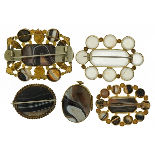 3060 - Four antique and later Scottish agate and white onyx brooches with gilt metal mounts and an oval loc... 