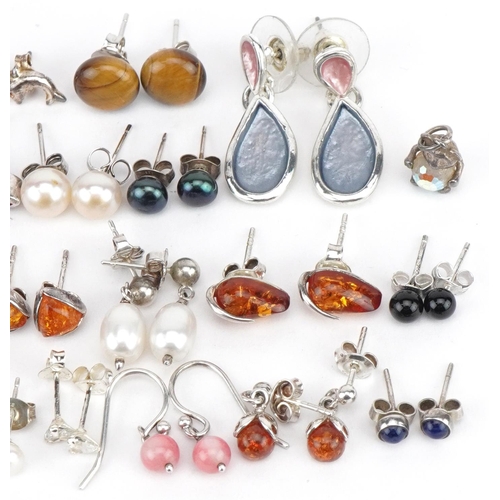 3667 - Selection of mostly silver earrings, some set with semi precious stones, including tiger's eye, ambe... 