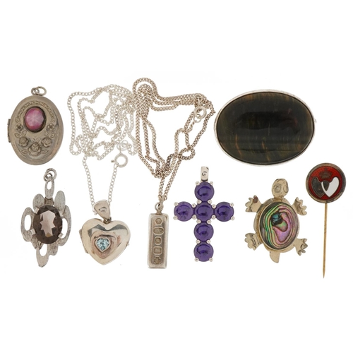 3535 - Silver and white metal jewellery including oval tiger's eye brooch, lockets, purple stone cross pend... 