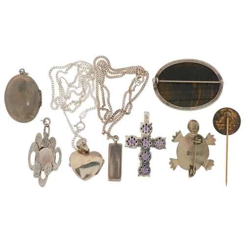 3535 - Silver and white metal jewellery including oval tiger's eye brooch, lockets, purple stone cross pend... 