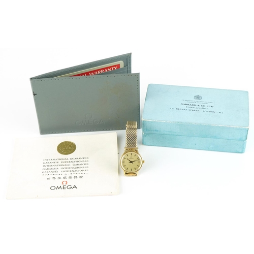 3048 - Omega, ladies 18ct gold wristwatch with 9ct gold strap with paperwork and Garrard & Co box, 21mm in ... 