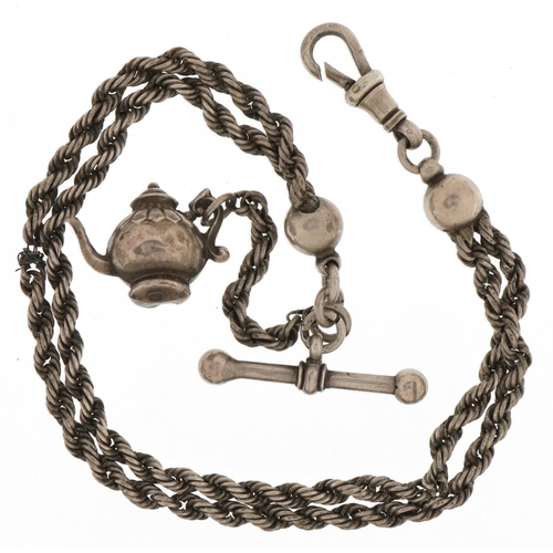 3677 - Victorian silver watch chain with T bar, dog clip clasp and a Victorian teapot charm, 26cm in length... 