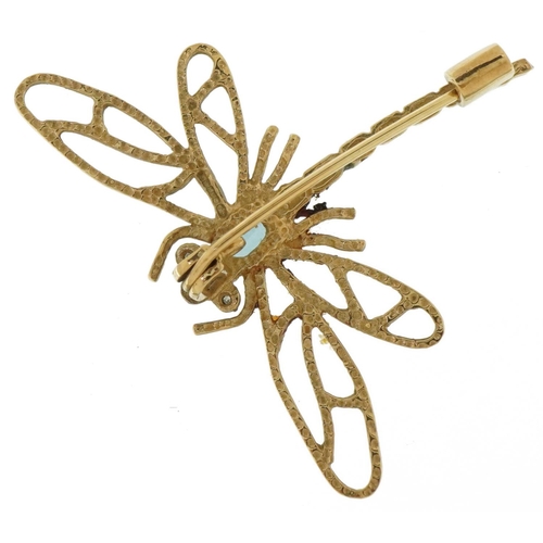 3591 - 9ct gold dragonfly brooch set with a blue topaz and white sapphires, 4.2cm wide, 4.0g