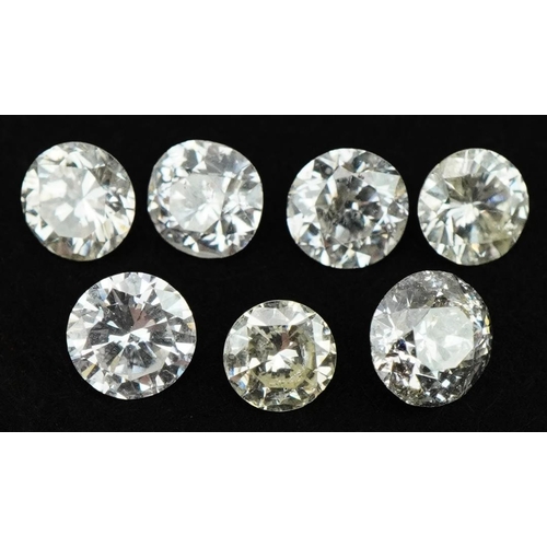 3601 - Seven loose diamond solitaires, the largest diamond approximately 0.17 carat