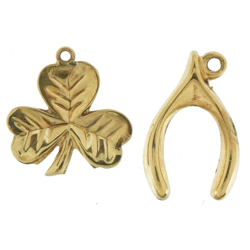 3651 - Two 9ct gold charms comprising a clover and wishbone, the largest 1.6cm high, total 1.0g