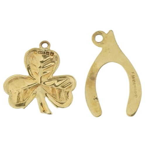 3651 - Two 9ct gold charms comprising a clover and wishbone, the largest 1.6cm high, total 1.0g