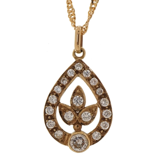 3455 - Unmarked gold clear stone teardrop pendant on a 9ct gold rope twist necklace, the pendant tests as 9... 