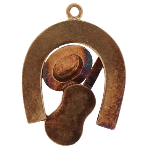 3460 - Unmarked gold pink topaz pendant in the form of a horseshoe, guitar and hat, tests as 9ct gold, 2.5c... 