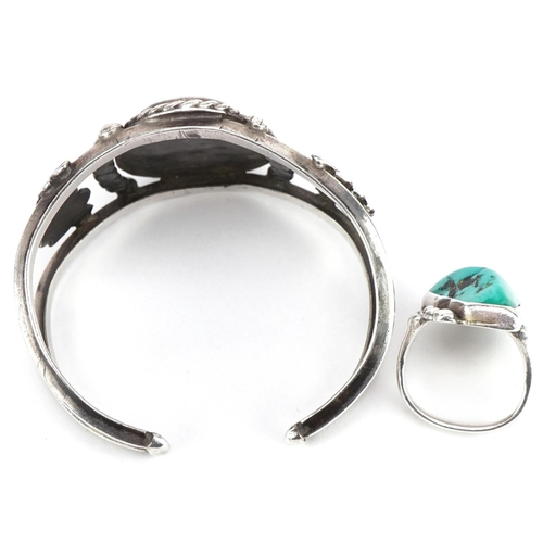 3628 - Naturalistic silver turquoise cuff bracelet and a silver and turquoise ring, size K, 52.0g