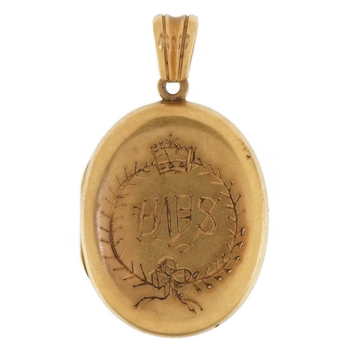 3078 - Antique unmarked gold locket with hinged interior, tests as 9ct gold, 4.7cm high, 21.8g