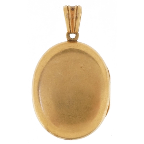 3078 - Antique unmarked gold locket with hinged interior, tests as 9ct gold, 4.7cm high, 21.8g