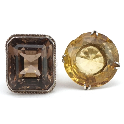 3578 - Two large silver smoky quartz and citrine rings, the citrine approximately 21mm in diameter, both si... 