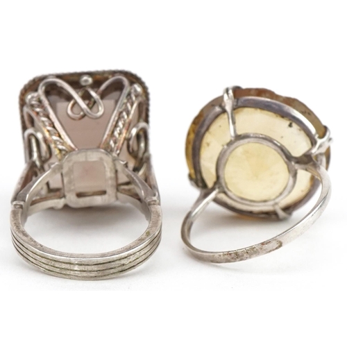 3578 - Two large silver smoky quartz and citrine rings, the citrine approximately 21mm in diameter, both si... 