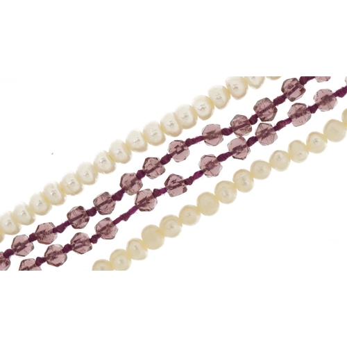 3640 - Two Freshwater pearl necklaces, one with 9ct gold clasp and an amethyst coloured necklace, the large... 