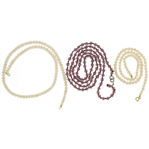 3640 - Two Freshwater pearl necklaces, one with 9ct gold clasp and an amethyst coloured necklace, the large... 