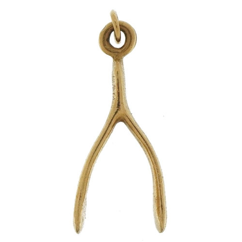 3642 - 9ct gold wishbone charm, 2.9cm high, 2.4g